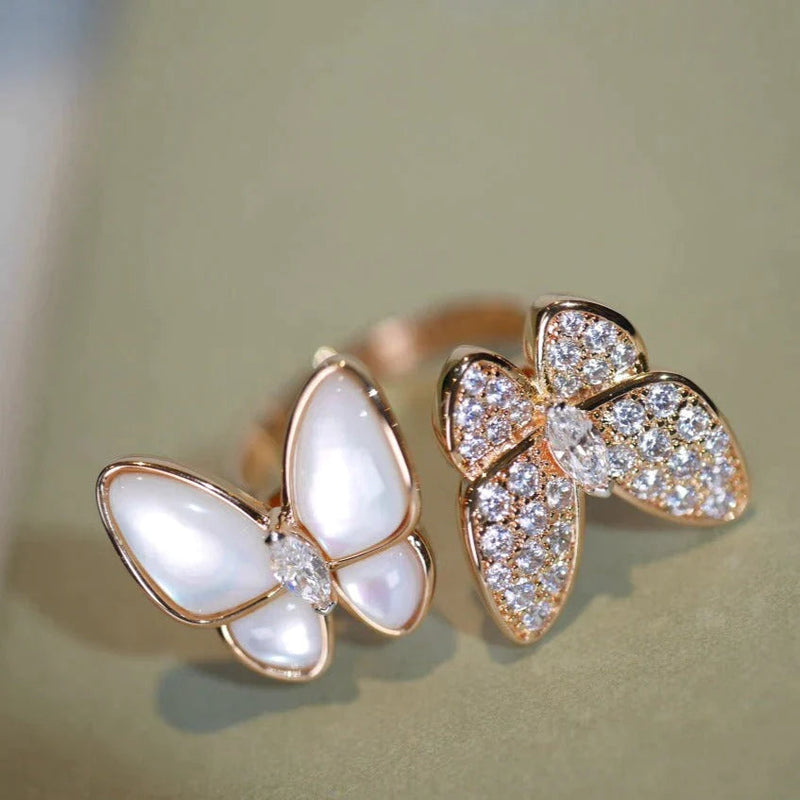 Two Butterfly Between The Finger Ring